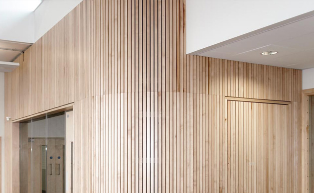 Slatted timber acoustic wall panels.